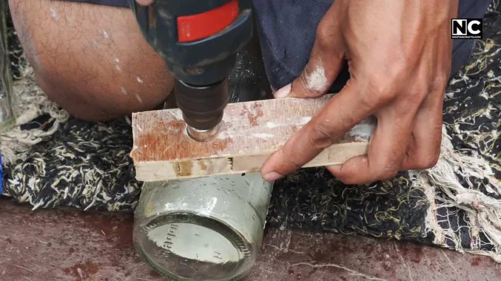 Insert the drill bit into the guide so it doesn't wander